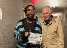 Ahmir Questlove Thompson (holding up first ever Def Jam Presents flyer) with Ed Bahlman