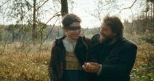 Agnes (Anja Plaschg) being led blindfolded by her husband Wolf (David Scheid) to where they will live