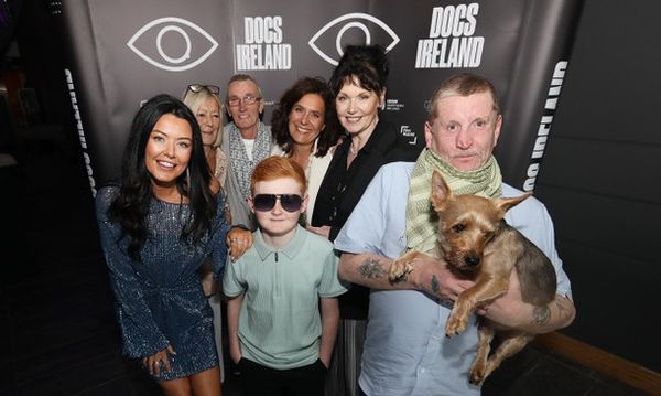 Front (L-R) Jolene Burns, Sean Parker, Joe McNally with Freedom the dog (Back L-R) Jolene's mum, Gerard Magee, Alessandria Celesia and Rita Overend pictured at the sold-out Belfast screening of The Flats at Docs Ireland 2024