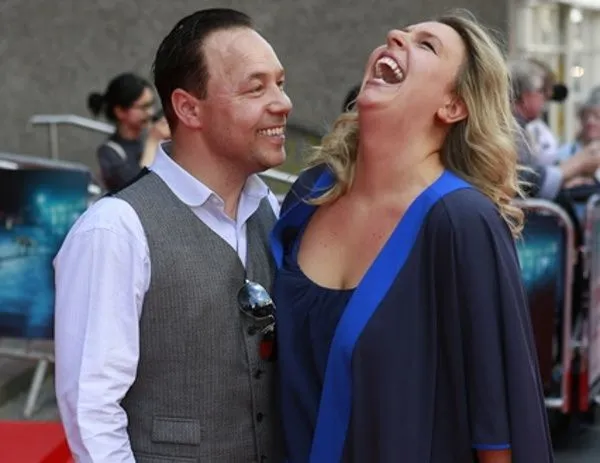 Stephen and Heather Graham share a joke on the red carpet