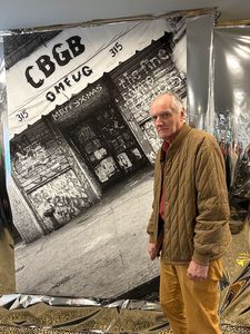 Ed Bahlman in front of Dustin Pittman’s CBGB photo, 1978, downstairs at Eerdmans